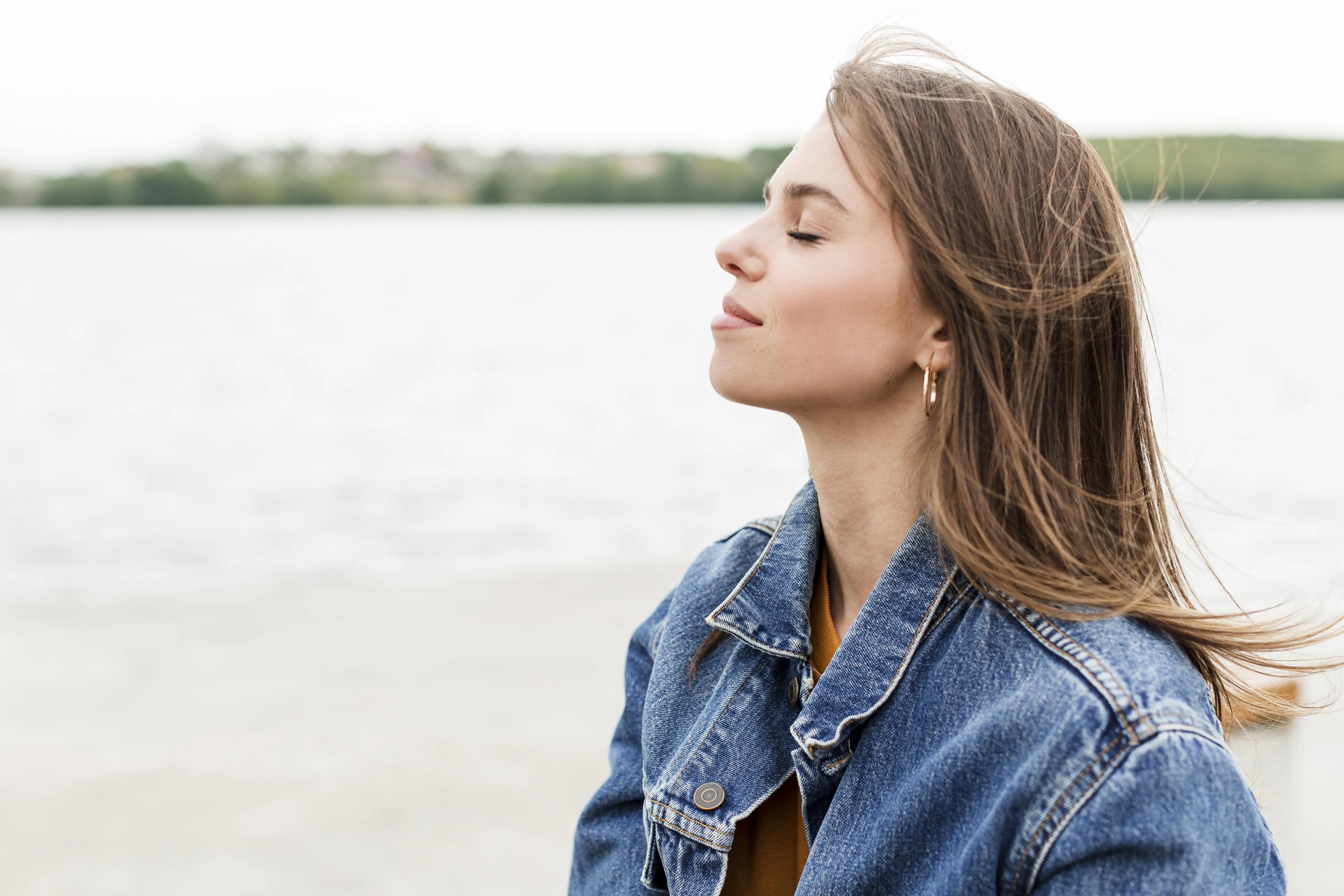 Woman breathing calmly by the sea